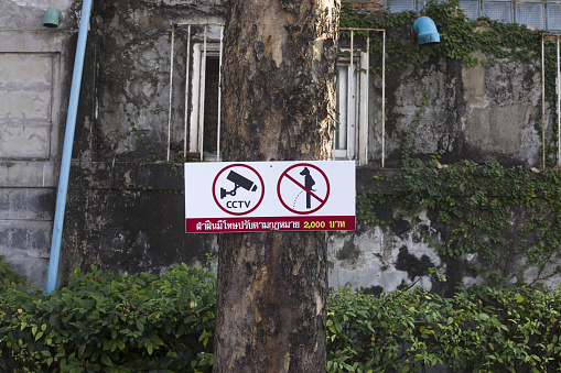 No ruination sign at tree of parking lot in restaurant area in Bangkok Ladprao