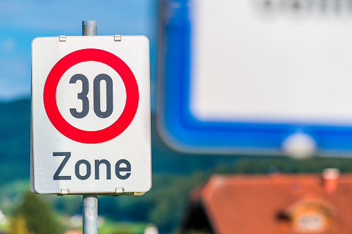 French road sign indicating 50 km per hour speed limit, selective focus