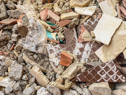 High angle view of broken tiles and rubble found in construction site