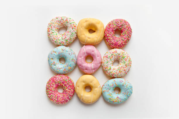 istock Colorful delicious donuts isolated on white background 1452920917