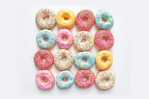 Colorful delicious donuts isolated on white background