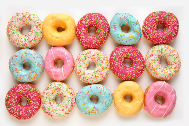 istock Colorful delicious donuts isolated on white background 1452920933