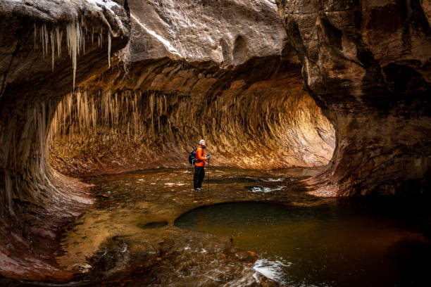 Hiker Taking In The Frozen Scene In The Subway in Zion