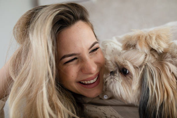 istock Woman Playing With Her Dog 1452925096