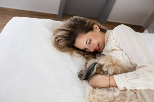 istock Woman Cuddling Her Dog 1452925098