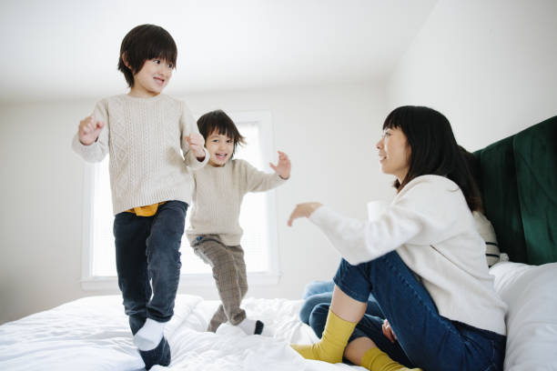 istock Boys Jumping On Parents Bed 1452926490