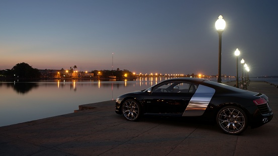 Antal, Turkey – August 25, 2021: A side view of a black Audi R8 4.2 Quattro parked on the coast of a river, Antalya, Turkey