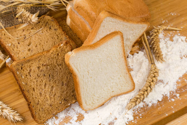 istock White and brown bread for toasting with ears and flour 1452927247