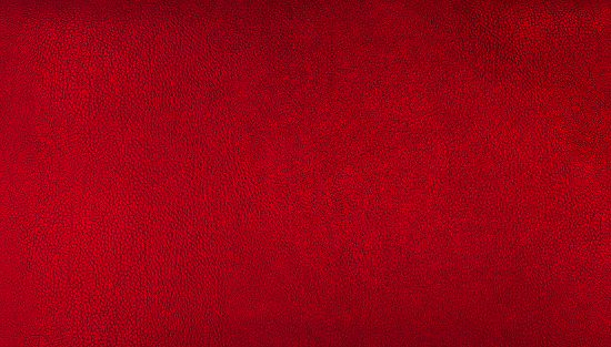 red elegance genuine leather texture background for vintage, classic concept. red crimson background for decorations and textures. bright brown color leather skin natural with visible details.