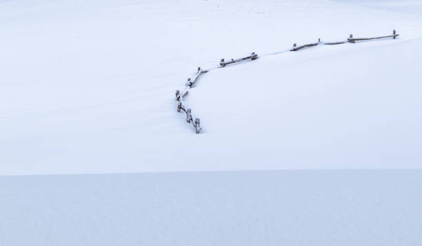 istock Wooden fence in deep snow 1452930646