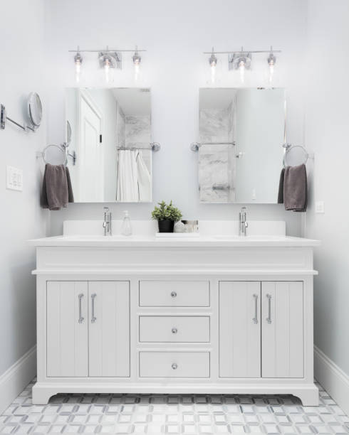 istock A bathroom with a white cabinet and mosaic tile floor. 1452930794