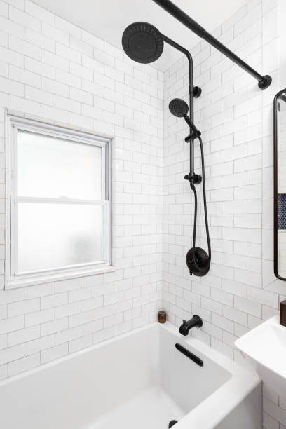 istock A shower with white subway tiles. 1452930819