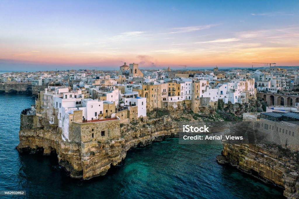 Polignano a Mare - Aerial View at Sunset Dramatic aerial view of Polignano a Mare, Bari, Italy Above Stock Photo