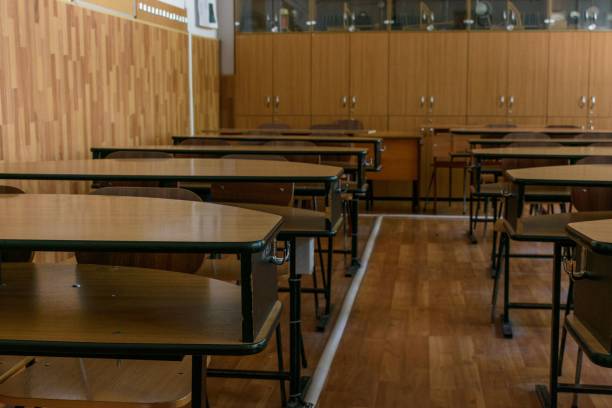 istock Classroom with wooden chairs 1452934153