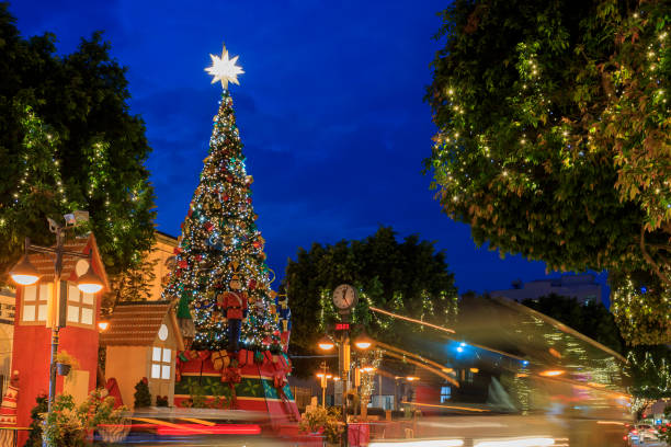 istock Illuminated Christmas tree and car lights 1452935279