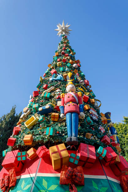 istock Christmas tree in front of blue sky 1452935285