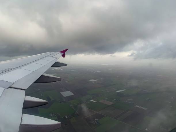 istock Scenic view of a plane wing high above the sky 1452936159