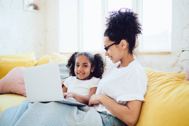istock Ethnic parent and kid watching film 1452938550