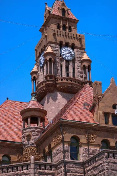 istock Vertical shot of an old clock tower in blue sky background 1452944710