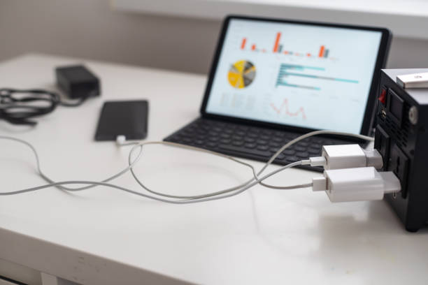 istock Charging station for phone, tablet, laptop and other gadgets when there is no light during blackout. Generator power bank battery in the absence of electricity. Charge electric rechargeable battery 1452947825