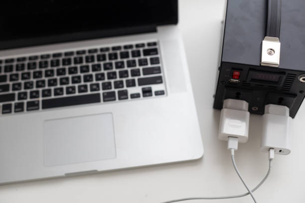 istock Charging station for phone, tablet, laptop and other gadgets when there is no light during blackout. Generator power bank battery in the absence of electricity. Charge electric rechargeable battery 1452948194