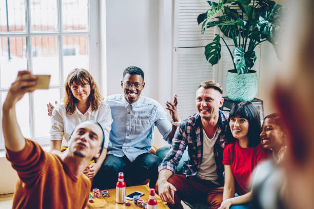 istock Funny friends taking selfie together 1452948742