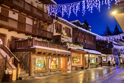 Courmayeur at dusk With Christmas decorations and mountain background