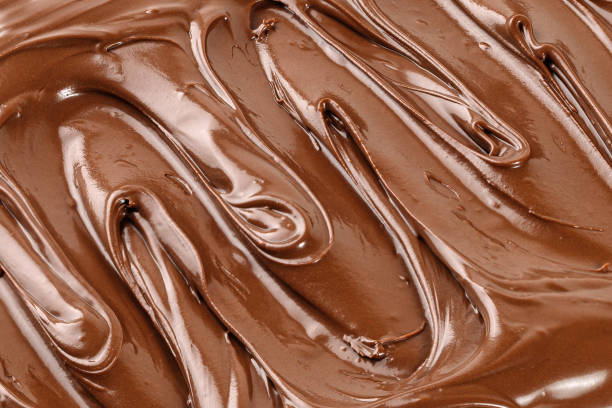 istock Chocolate cream, sauce, paste, syrup. Background of  Liquid chocolate. Curl. Texture, Close up, top view. 1452953404