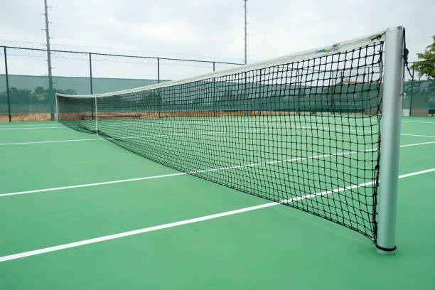 istock Green tennis court with net 1452954822