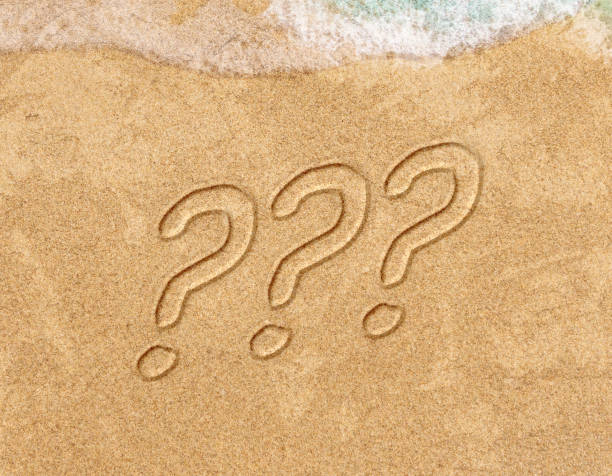 istock question mark sign handwritten in sand beach 1452956066