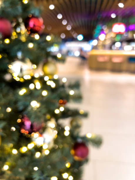 istock blurred decorated christmas tree in shopping mall background 1452956112