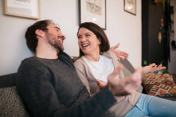istock Happy young couple having fun together at home 1452958269