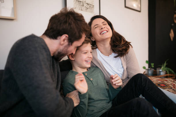 istock Young family having fun at home together 1452958270
