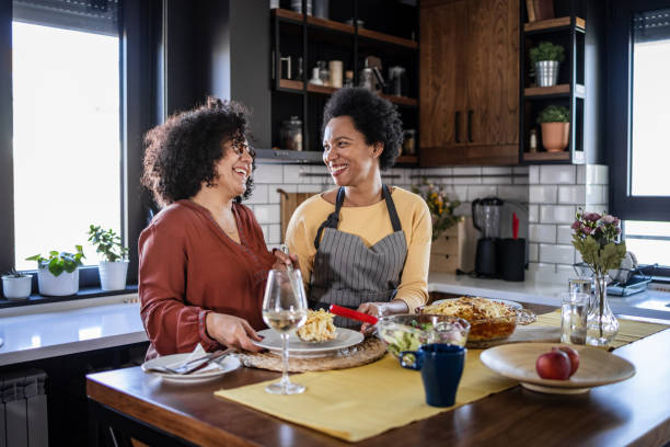 istock Two women enjoying lunch at home 1452962559