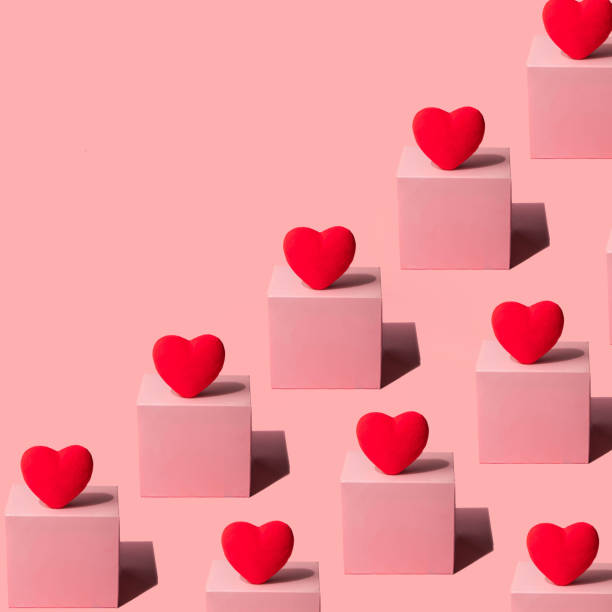 istock Red heart pattern on pastel light pink background. Modern Valentine's Day concept. Creative love idea. Minimalistic Mother's Day composition. 1452973236