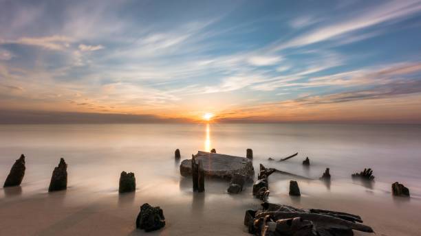 istock View of rock formations in beach of Cape May during sunset 1452979087