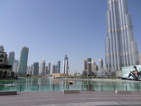 Dubai, United Arab Emirates – October 20, 2014: Lake in front of the biggest mall of the world. Dubai Mall.