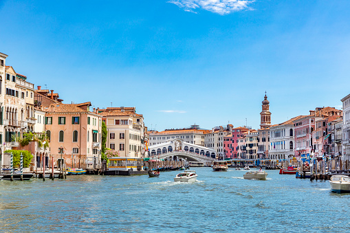 Venice, Italy - July 1, 2021: view from grand canal to rialto bridge in afternoon sun in Venice, Italy.