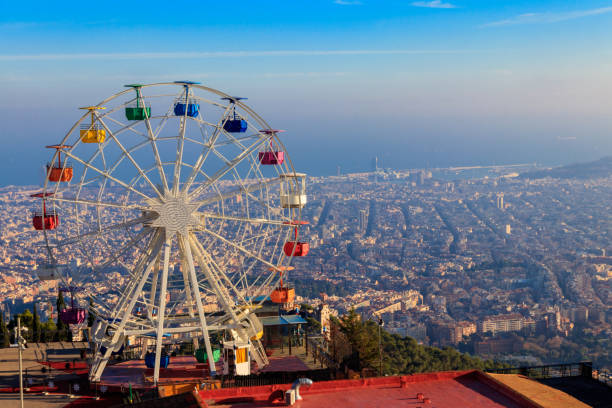 Ferris wheel in Tibidabo mount with panoramic view over Barcelona, Catalonia, Spain stock photo