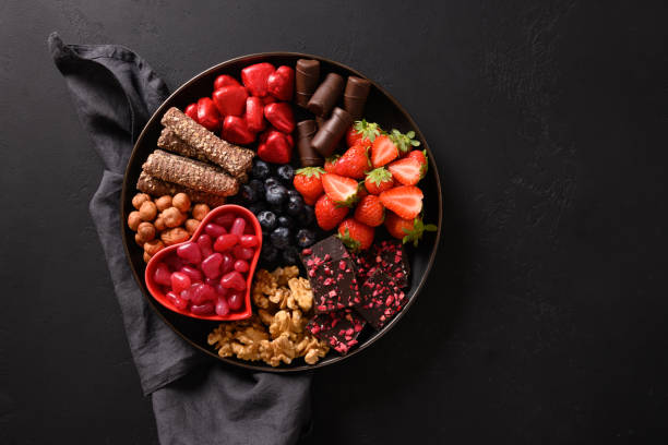 istock Charcuterie Valentines Day board with chocolate sweets. 1452995304