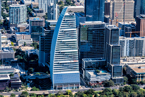 Aerial view of One World Trade Center in front of skyscraper buildings, New York City, New York State, USA.