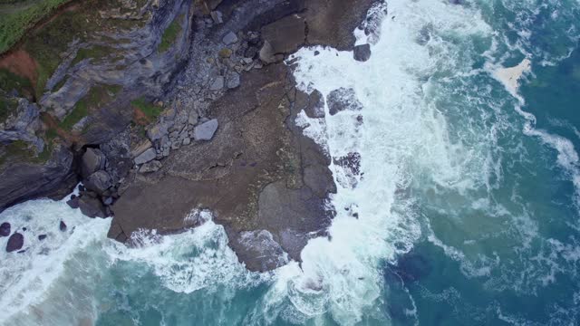Drone capture the Cantabrian sea and the shore of the island of Isla from a great height