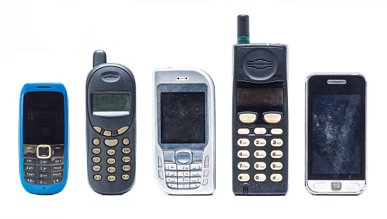 group of old and obsolete mobile phone on white background