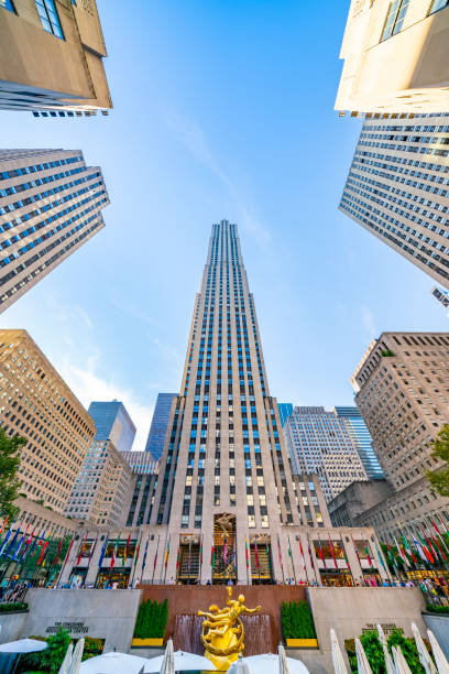 Rockefeller Center is a complex consisting of 19 commercial buildings covering 22 acres in Midtown Manhattan, commissioned by the Rockefeller family. United States, New York City - September 14, 2019: Rockefeller Center is a complex consisting of 19 commercial buildings covering 22 acres in Midtown Manhattan, commissioned by the Rockefeller family. rockefeller ice rink stock pictures, royalty-free photos & images