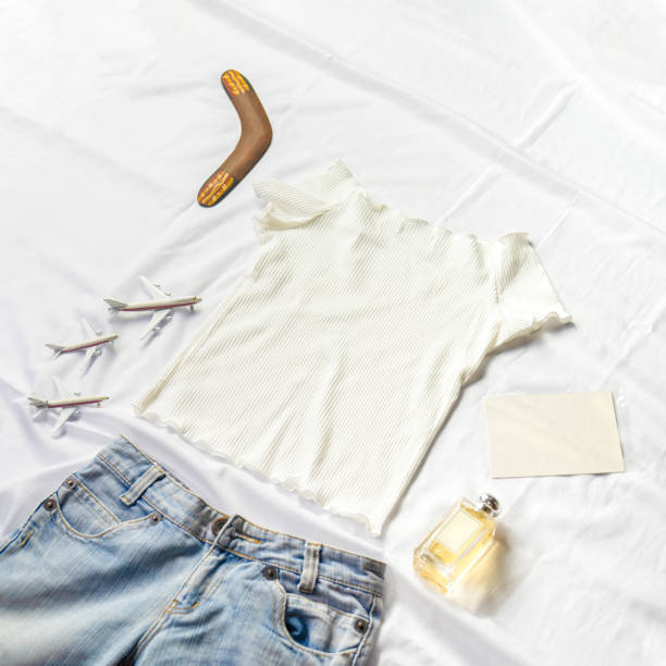 istock On the table were models card, perfumes and notebooks lying around a white shirt and jeans. 1453006361