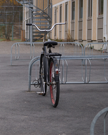 A bicycle parked on a school yard