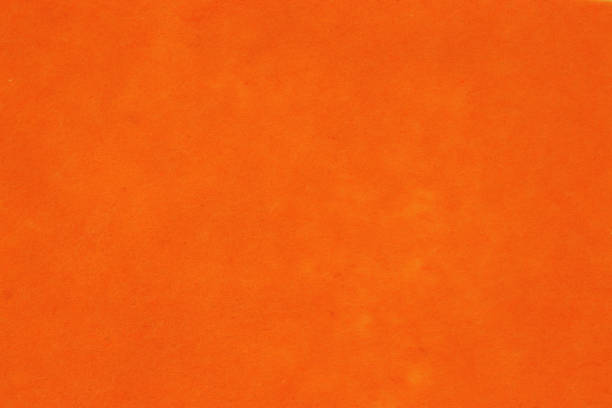 istock orange color textured background ,free space for your text 1453026885