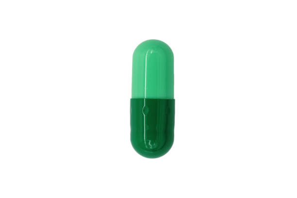 istock green capsules isolated on white background,Top view 1453026887