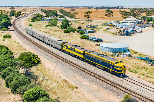 Long Plains, Australia - Nov 30, 2022: Waiting in the loop: aerial view of the ARTC Track Geometry Test Cars, known as the AK Cars, wait in Long Plains crossing loop (passing siding) with veteran EMD Streamliners S303 and GM10 for the  Pacific National \