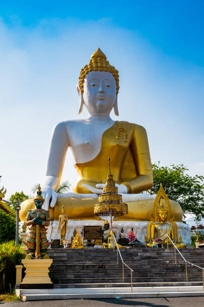istock White Buddha statue of Phra That Doi Kham temple 1453031362
